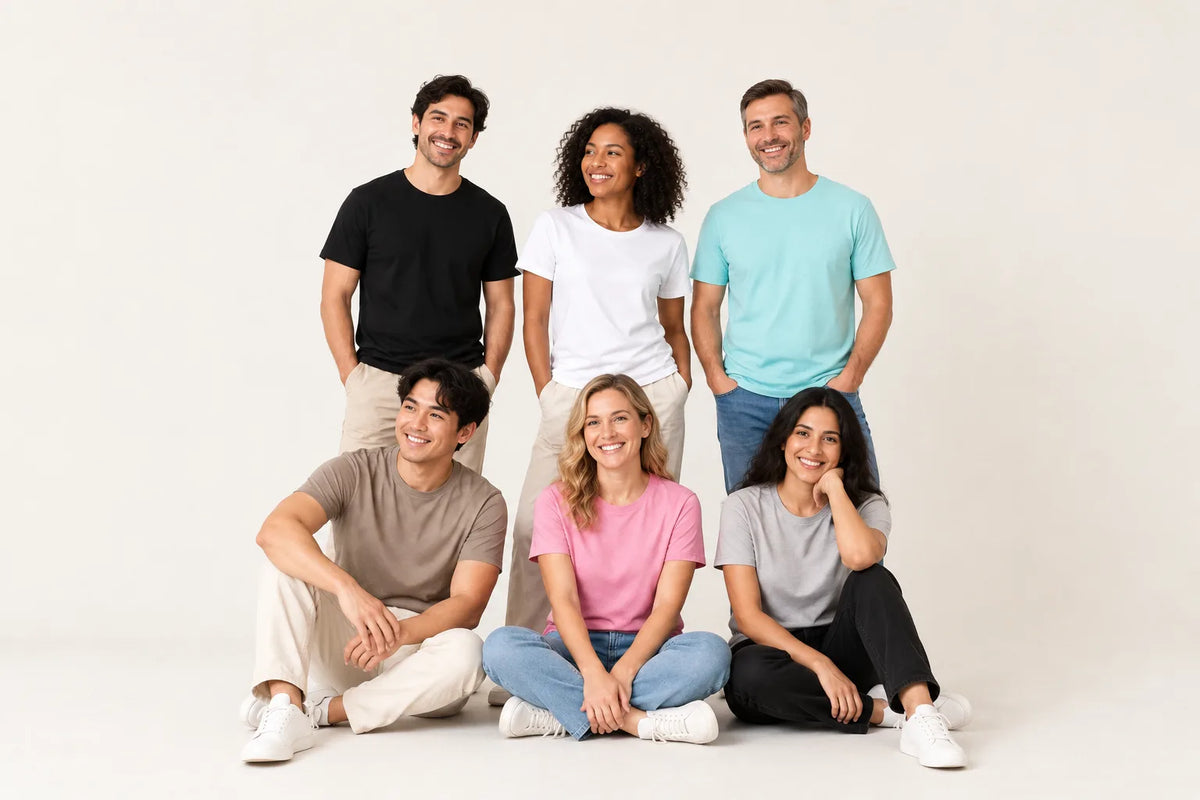 Diverse group of adults wearing casual t-shirts and jeans in a studio setting